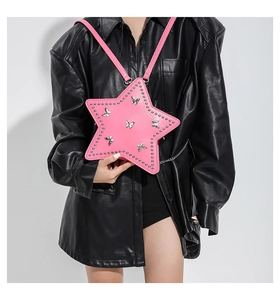 Close-up of pink star-shaped rivet backpack with butterfly pattern on female model