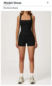Front view of premium black seamless yoga set featuring racerback tank and high-stretch shorts