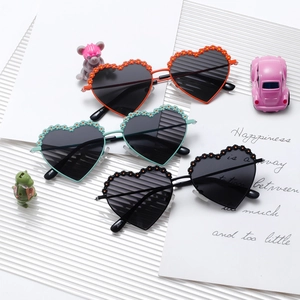 Polarized heart-shaped kids sunglasses with flower accents in orange, green and black