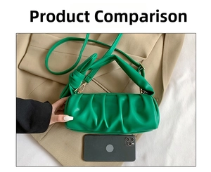 Detailed size comparison of the green pleated cloud bag shown with a mobile phone