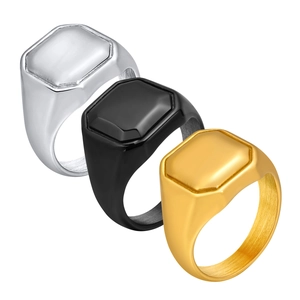Three-piece set of brushed stainless steel signet rings in silver, black, and gold colors