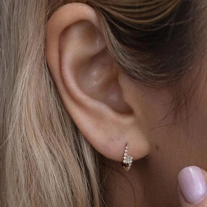 Close-up of 14K gold plated S925 silver hoop earring with sparkling zircon stones