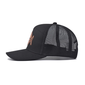 Detail view of black trucker hat with mesh back and vintage star embossed leather patch