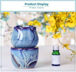 Detail of tulip shaped ceramic essential oil burner with reactive blue glaze finish