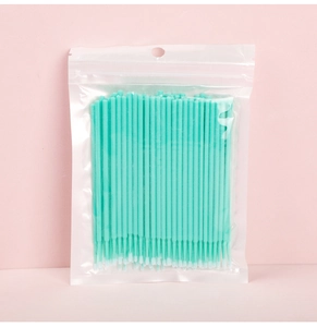 Micro brushes for eyelash extension cleaning in a transparent bag with mint green handles