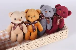 Macro detail of plush teddy bear charms in four colors with Love ribbon in a basket