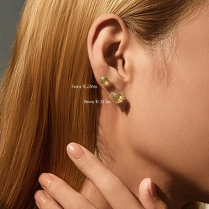 S925 sterling silver yellow gemstone studs in 7mm and 8mm sizes shown on a model