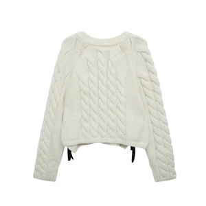Chic cream cable-knit sweater with round neck and decorative side black ribbons
