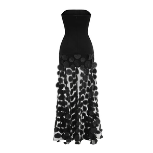 Detail of back invisible zipper and sheer mesh tulle fabric with polka dots on black dress