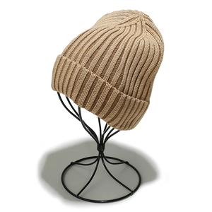 Detail of khaki ribbed knit beanie showing high-quality cotton texture and folded cuff