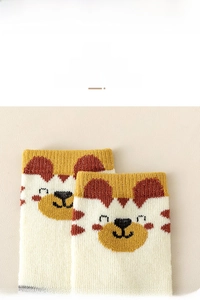 Detailed macro view of elastic ribbed cuff on children's warm knit socks with tiger pattern