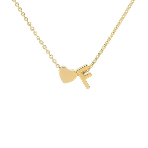 Detail of 18k gold plated heart pendant with letter F on minimalist necklace