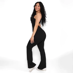 Side view of black backless jumpsuit featuring U-neck and elegant flare leg design