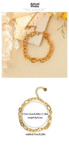 Macro detail of golden oval link bracelet with 18K gold plating and 17cm adjustable chain