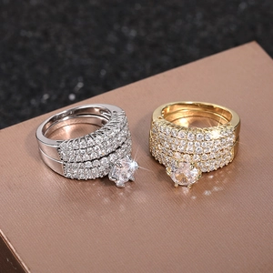 Close-up of luxury bridal ring sets with sparkling pavé cubic zirconia in gold and silver