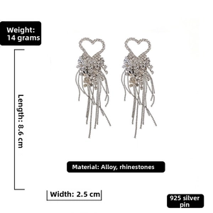 Detail view of heart-shaped rhinestone earrings with tassel fringe and product dimensions