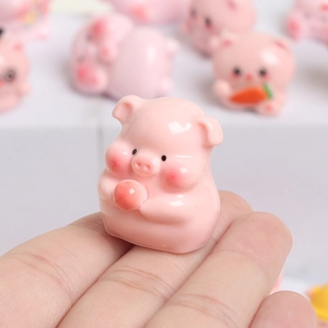 Cute pink resin mini pig figurine holding a ball for DIY decor and tabletop ornament