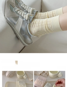 Close-up of pastel cotton socks featuring vertical ribbed texture and sweet bow details