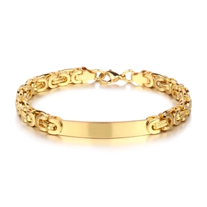 Detail of golden Byzantine chain bracelet with polished ID bar and lobster clasp