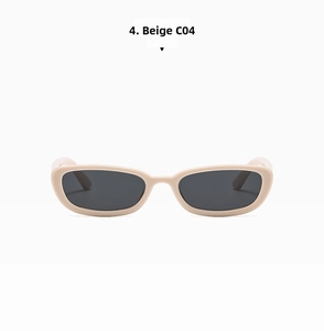 Detail view of vintage beige cat-eye sunglasses with dark grey translucent lenses