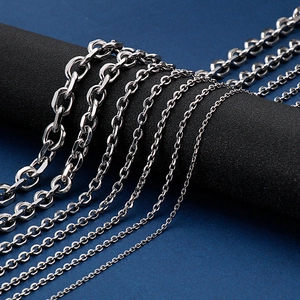 Versatile stainless steel O-link chains in multiple sizes displayed on a professional stand