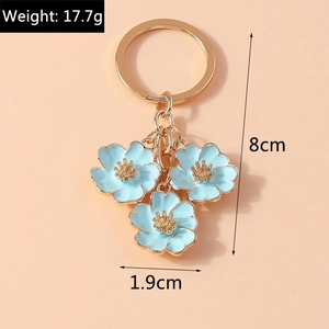 Detail of sweet blue flower keychain with gold metal ring and 17.7g weight info