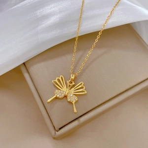 Elegant gold butterfly necklace with sparkling cubic zirconia on a luxury jewelry box