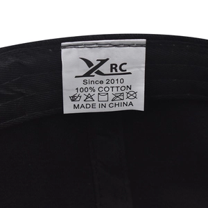 Detail view of cotton baseball cap interior featuring a 100% cotton wash label and XRC brand