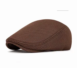 Macro detail of breathable mesh fabric on dark coffee newsboy cap showing texture