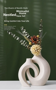 Close-up of beige matte ceramic nested ring vases with artistic light and shadow play