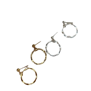Minimalist round twisted hoop earrings in gold and silver finish with textured surface