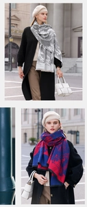Close-up of soft cashmere-like scarf with abstract patterns and tassel details