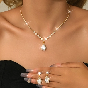 Detailed close-up of a pear-shaped zircon jewelry set on skin with glowing light effects