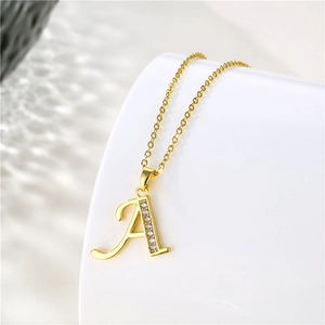 Detailed close-up of 18K gold letter A pendant with micro-inlaid zircons and fine O-chain