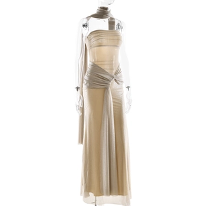 Detail showing shimmering champagne sequin fabric and drape texture on dress