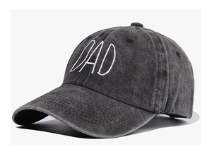 Close-up of DAD embroidery on a vintage washed dark grey cotton baseball cap