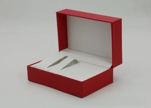 Detailed interior of red PU leather watch gift box with white dual watch cushions