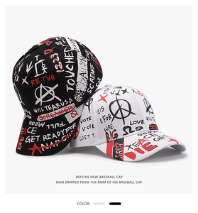 Close-up of street graffiti baseball cap with printed peace and love letters