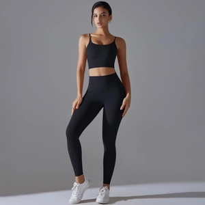 Detail view of high-waist black yoga leggings and slim straps sports bra set