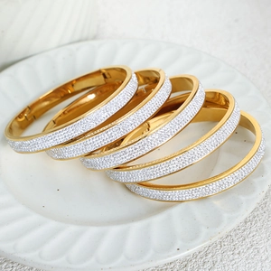 Gold vintage style stackable titanium steel bangles with full crystal pavé detailing