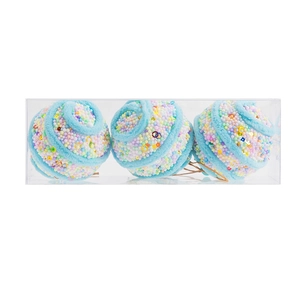 Three light blue Christmas ornaments with sequins and foam beads in a transparent box
