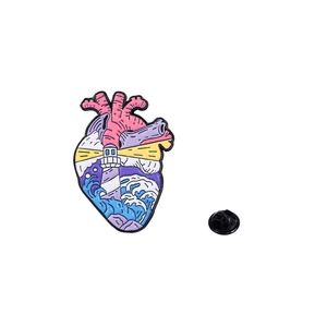 Artistic Van Gogh inspired heart enamel pin featuring a lighthouse and ocean waves design