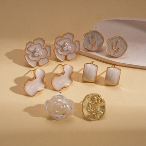 10-pair set of vintage resin flower stud earrings with gold finish and floral patterns