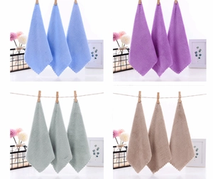 Detail view of microfiber coral fleece towels in blue, purple, green and khaki