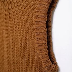 Women's vintage caramel turtleneck knit vest showing sleeveless rib texture design