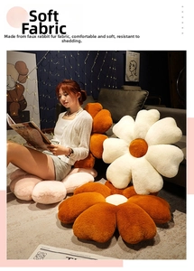 Detail of soft faux rabbit fur flower pillow in living room with cozy home decor