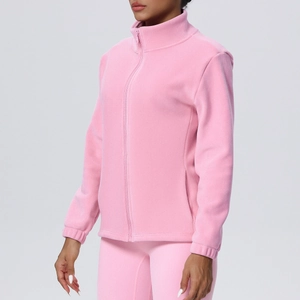 Close-up of pink high-neck fleece jacket with zipper and soft textured fabric detail