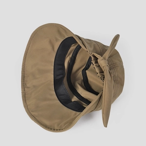 Detail of khaki sun hat featuring inner black sweatband and decorative rear bow tie