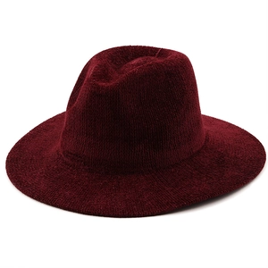 Detailed close-up of burgundy wide brim fedora hat showing thick knit texture and structure