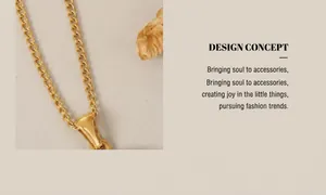 Detailed macro view of an 18K gold plated wing pendant on a fine titanium steel chain link